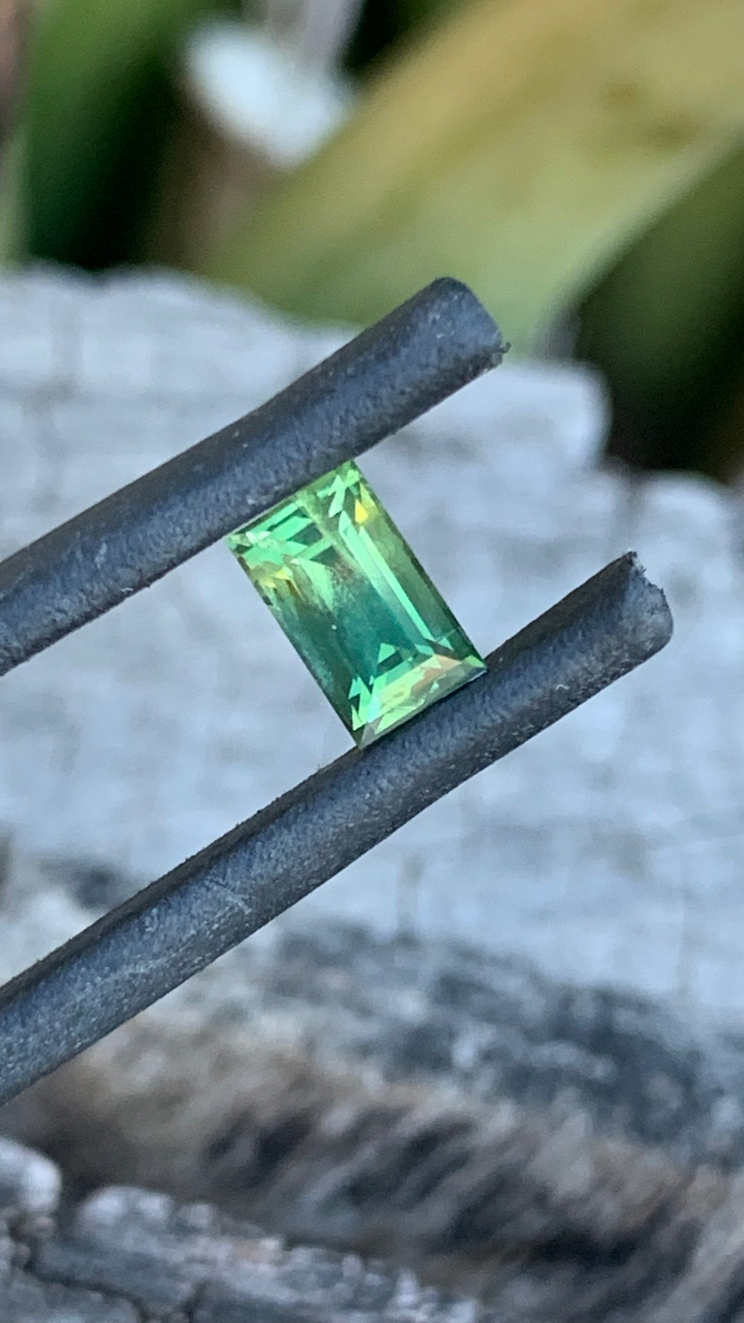 Baguette cut Australian sapphire with light green and yellow zoning