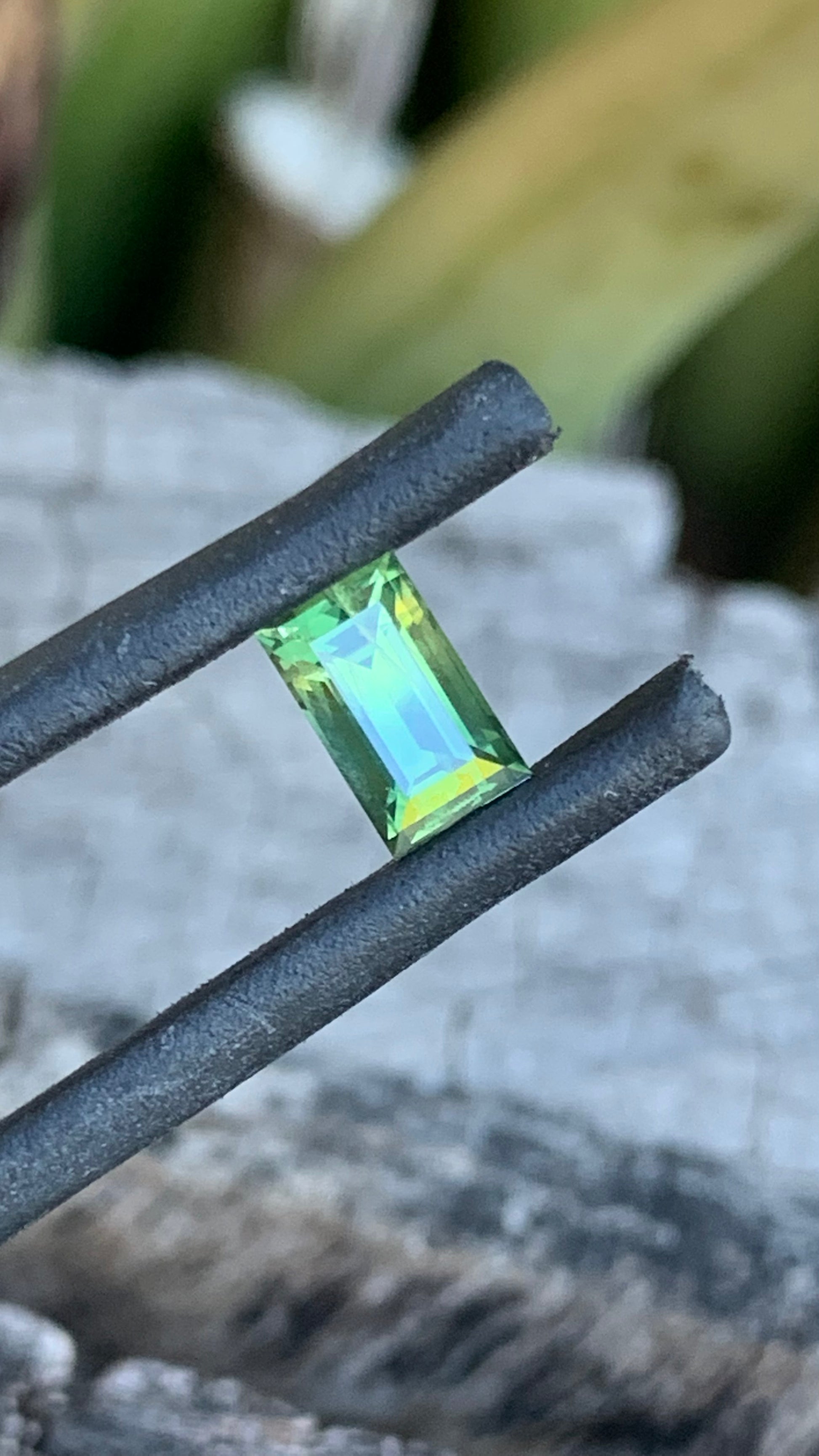 Light green baguette cut Australian sapphire with yellow zoning