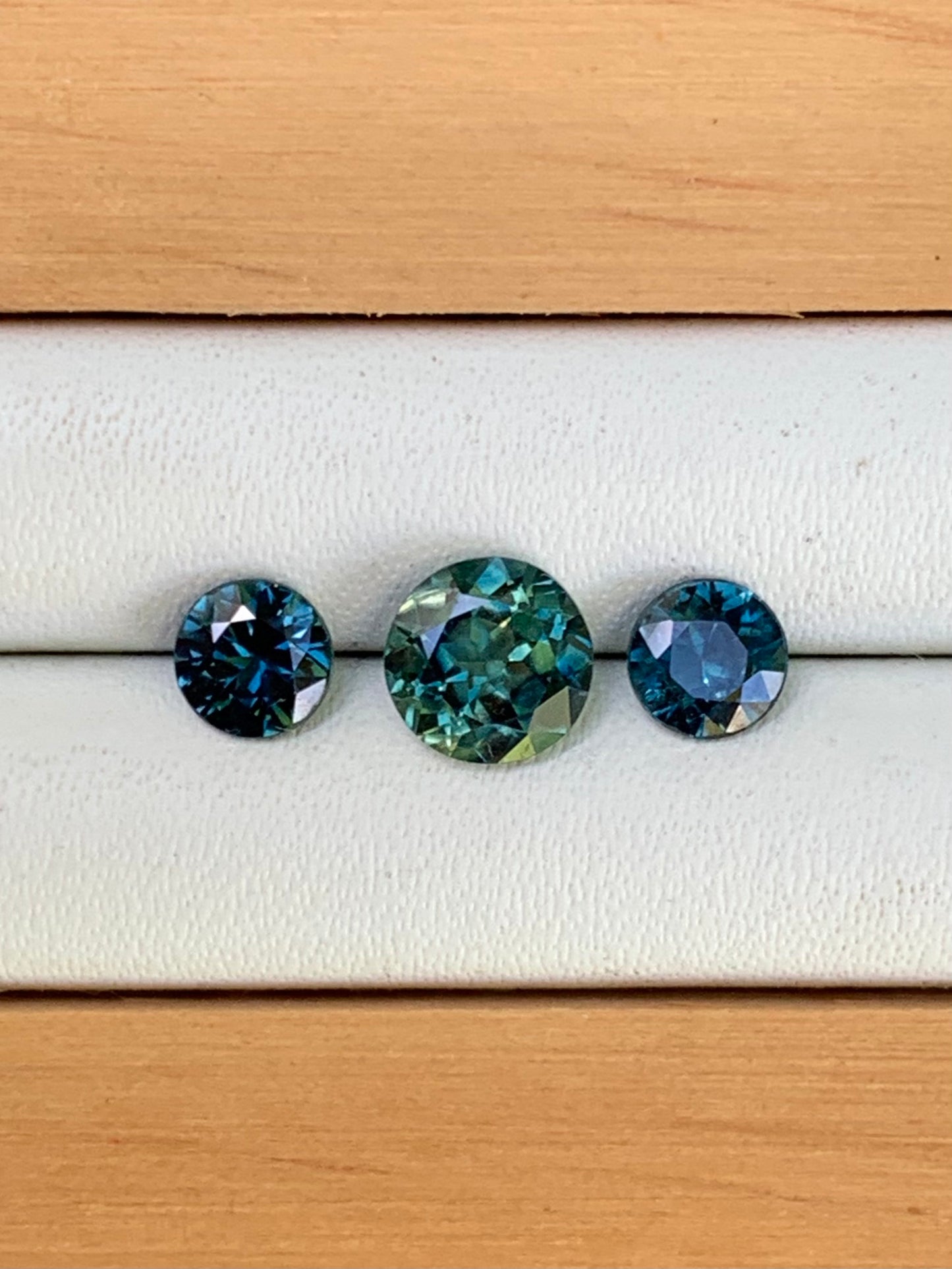 teal centre and blue Australian close up of sapphire trilogy set 1.78ct loose gemstones