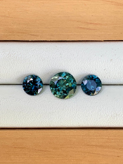 teal centre and blue Australian close up of sapphire trilogy set 1.78ct loose gemstones