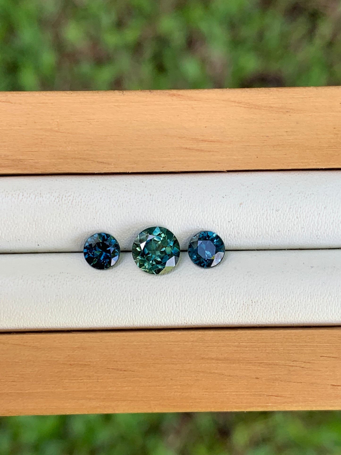 Australian sapphire trilogy teal centre and blue accents loose set