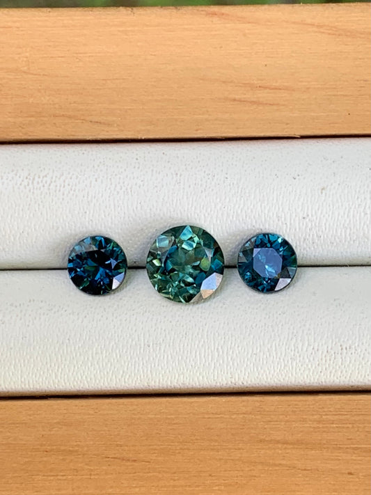 teal centre and blue Australian sapphire trilogy set 1.78ct loose gemstones
