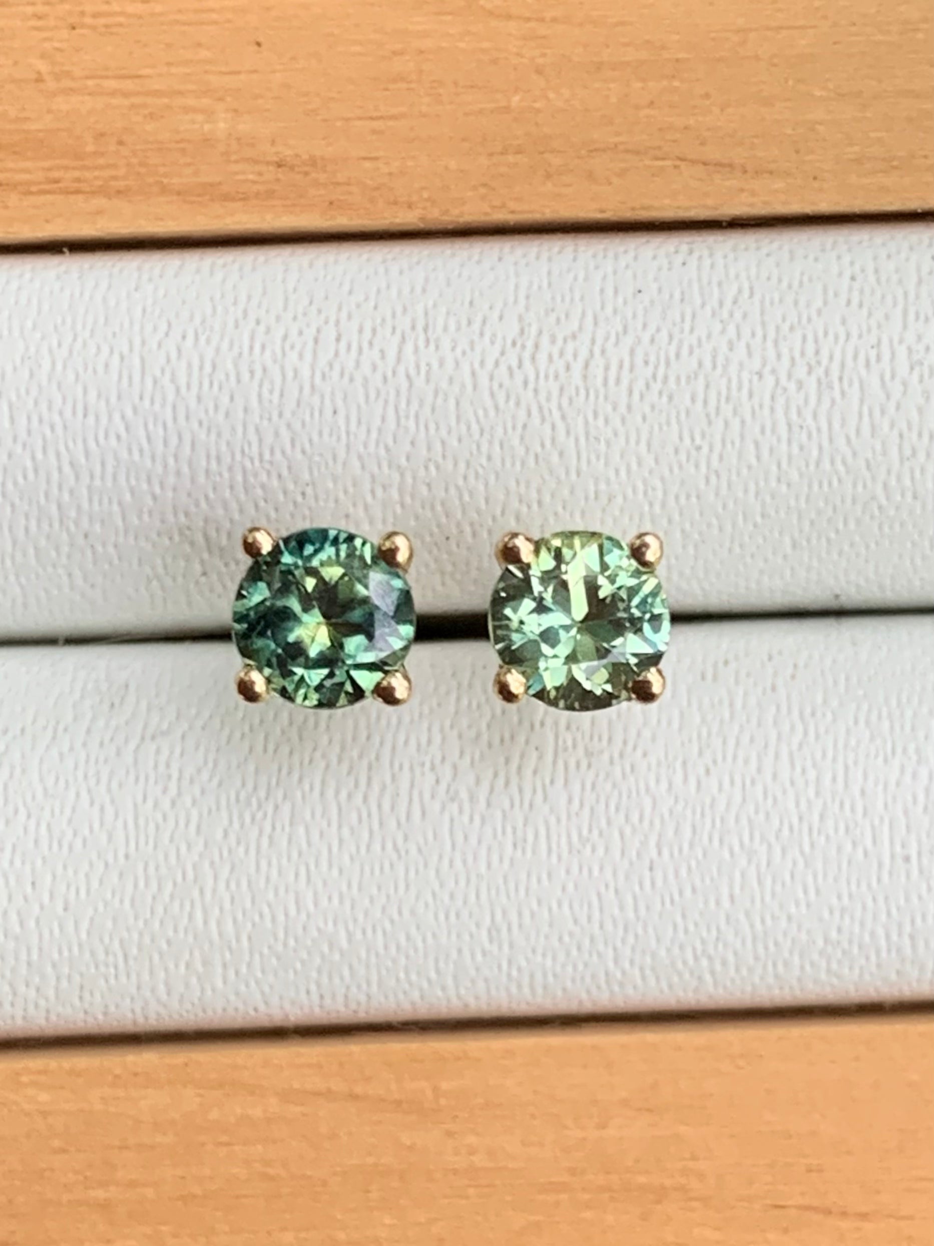 Close up of Australian Parti Sapphire Stud Earrings