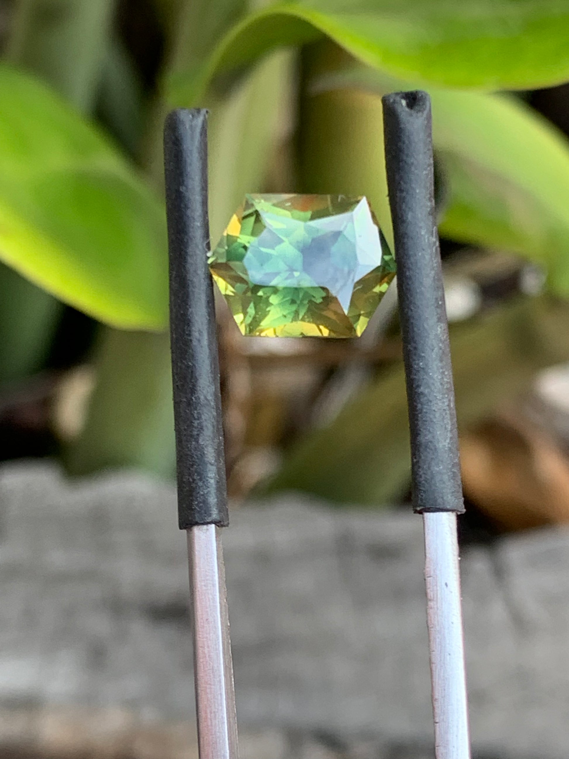 close up green yellow parti sapphire unheated Queensland gemstone hex cut