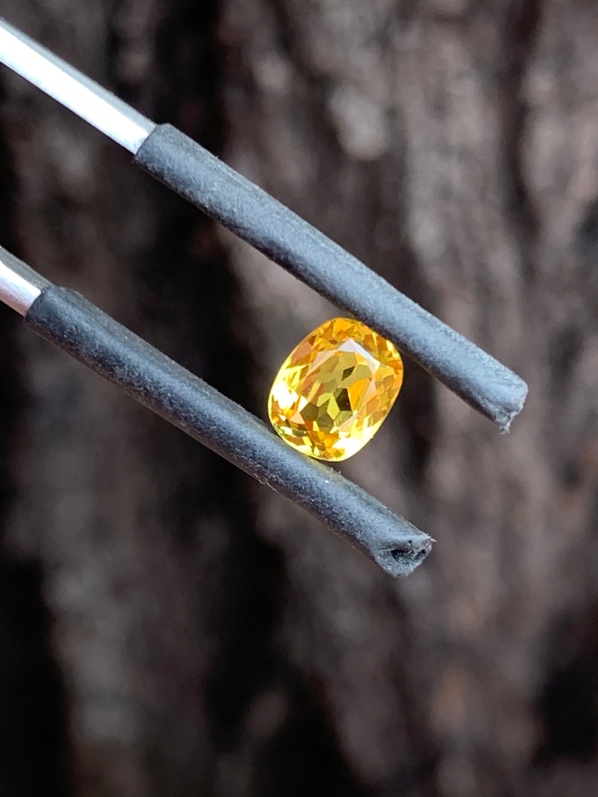 close up vivid yellow sapphire unheated Queensland gemstone cushion cut