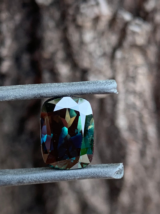 large cushion cut Australian parti sapphire moody tones yellow colour zone