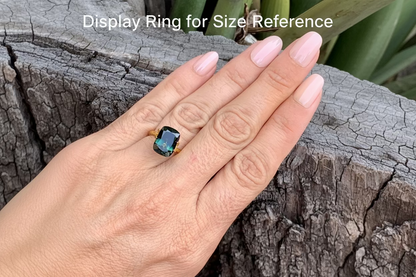 On Hand Photo of Australian sapphire cushion cut large natural parti stone with colour zoning