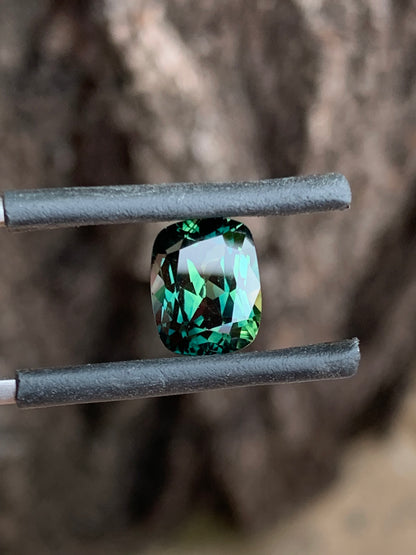 large Australian sapphire cushion cut teal parti with natural colour banding