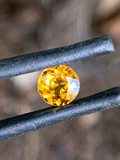 Round brilliant orange sapphire sourced from the Central Queensland Gemfields