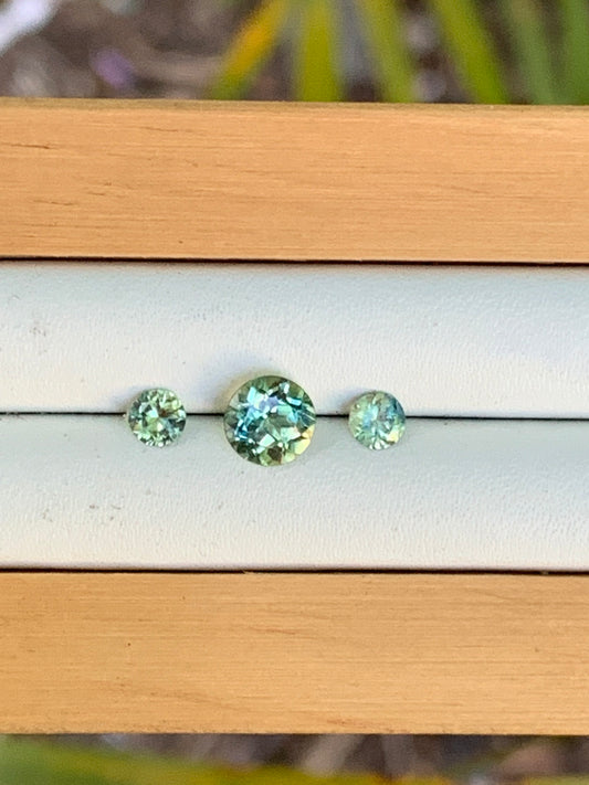 Three vibrant yellow parti Australian sapphires arranged for a trilogy ring