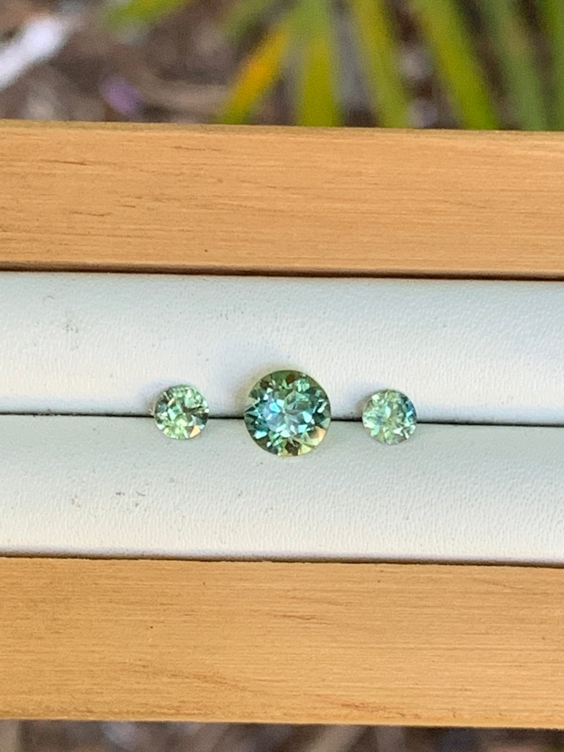 Close-up of three natural unheated Australian sapphires for a trilogy ring