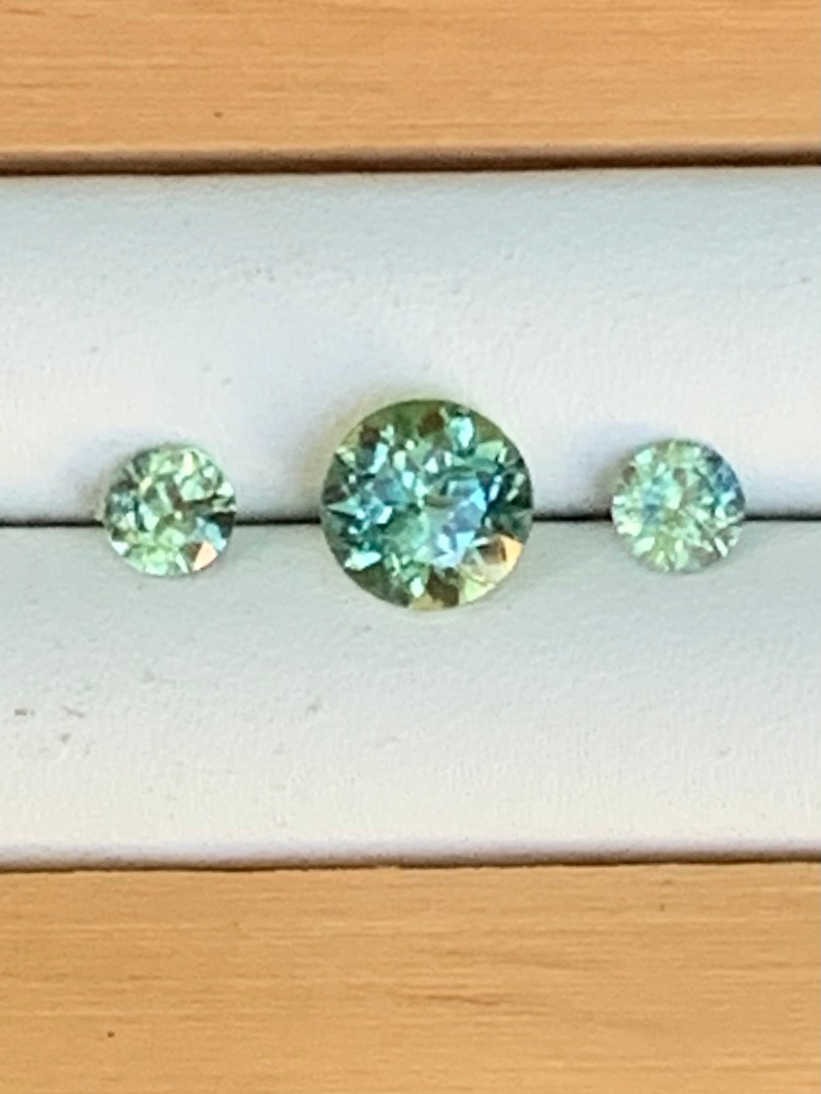 Natural Australian sapphire trilogy set with yellow parti centre stone