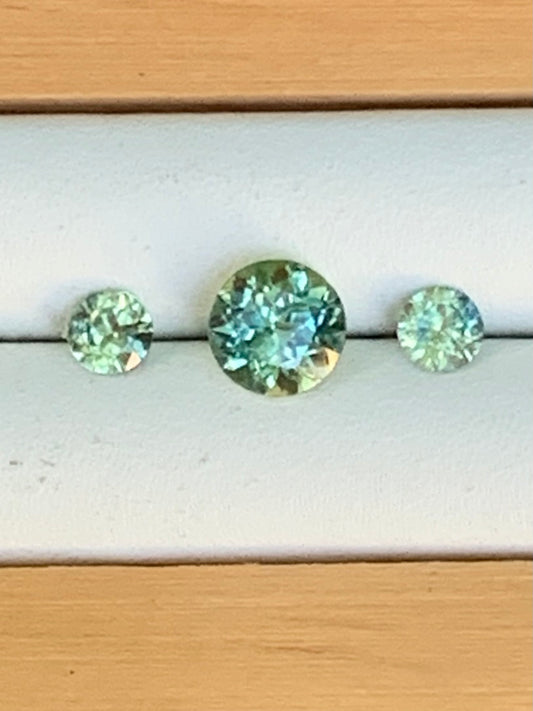Natural Australian sapphire trilogy set with yellow parti centre stone