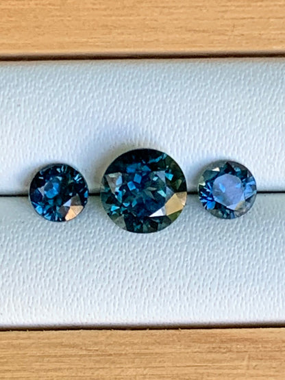 1.78ct unheated blue parti Australian sapphire trilogy set on white background