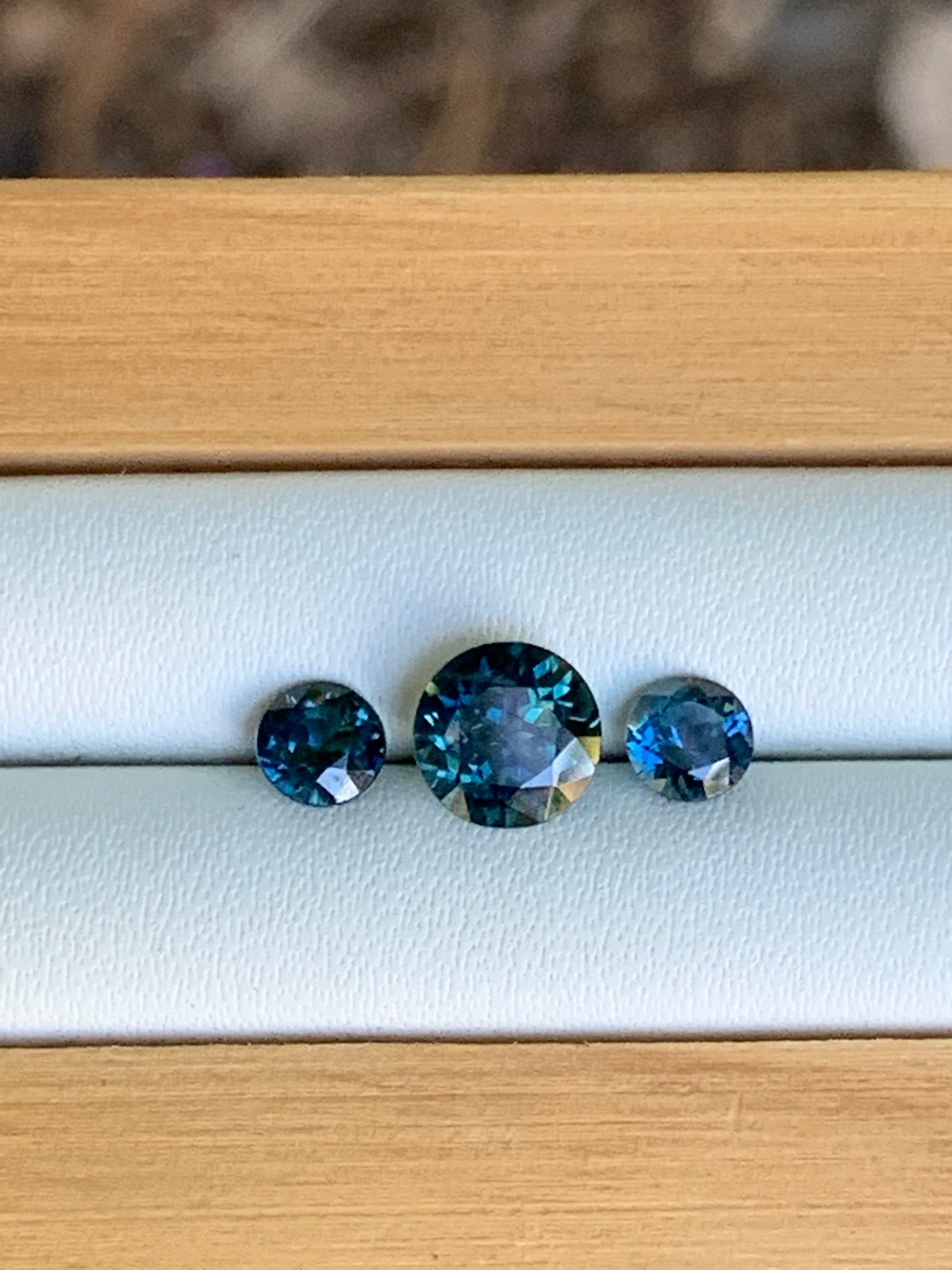 Three unheated blue parti Australian sapphires arranged for a trilogy ring