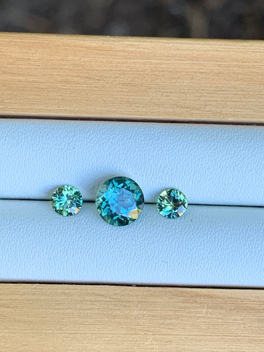 Three unheated teal parti Australian sapphires arranged for a trilogy ring