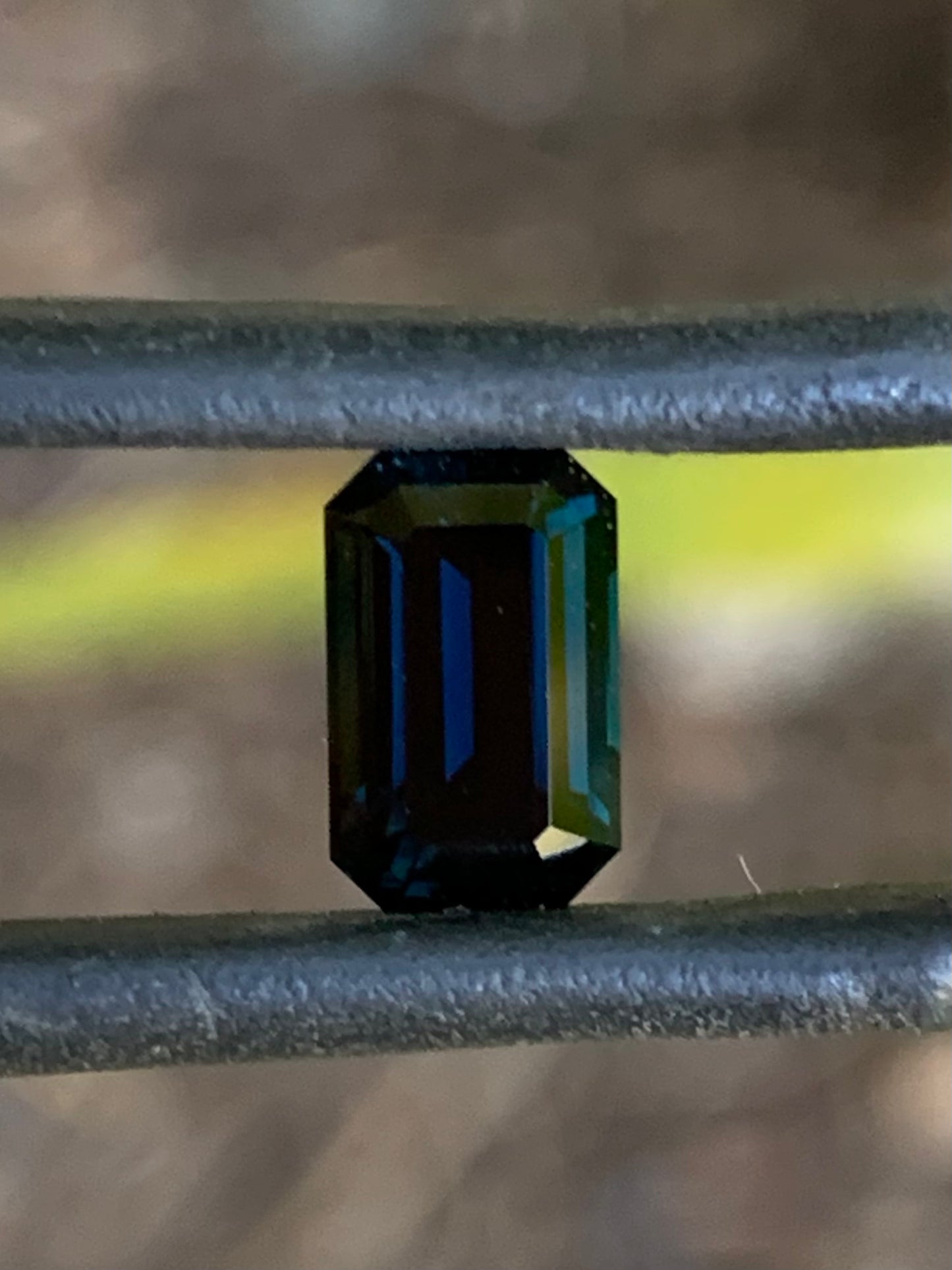Natural Australian sapphire with dark blue colour and classic emerald cut