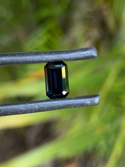 Natural heated dark blue Australian sapphire with refined step-cut facets