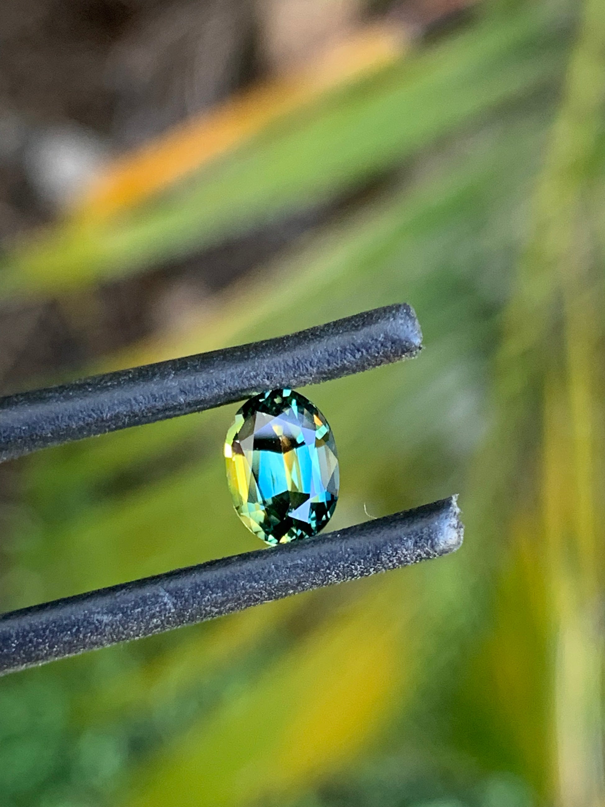 Close-up of a 1.08ct oval teal parti sapphire from Australia