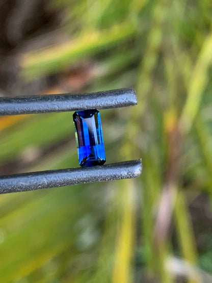Close-up of a rich blue emerald cut sapphire from Australia