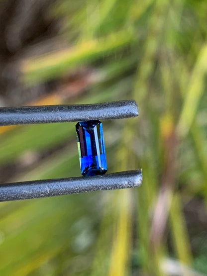 Natural emerald cut sapphire with dark blue and light banding
