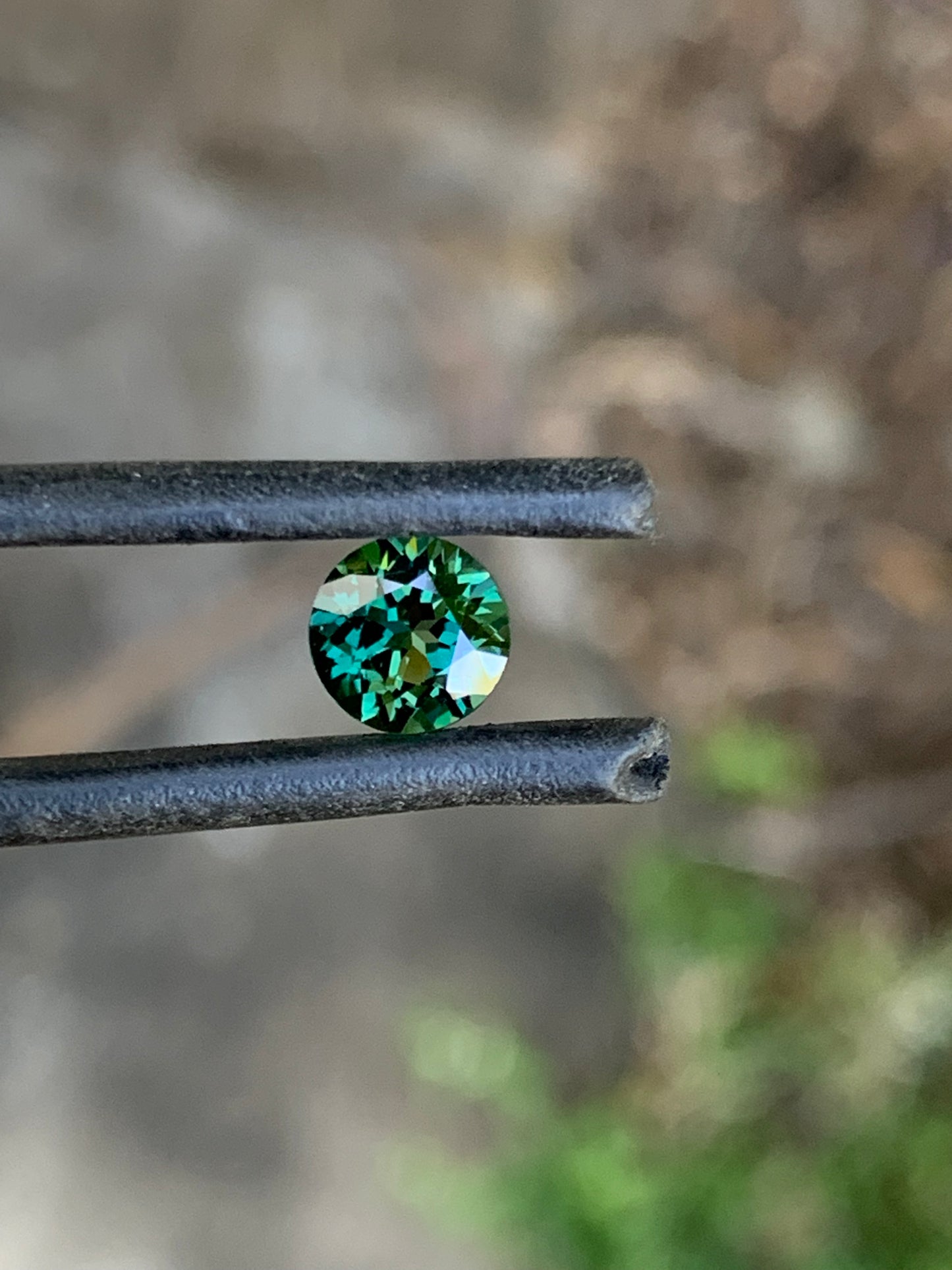 Eye clean teal Australian sapphire with yellow zoning