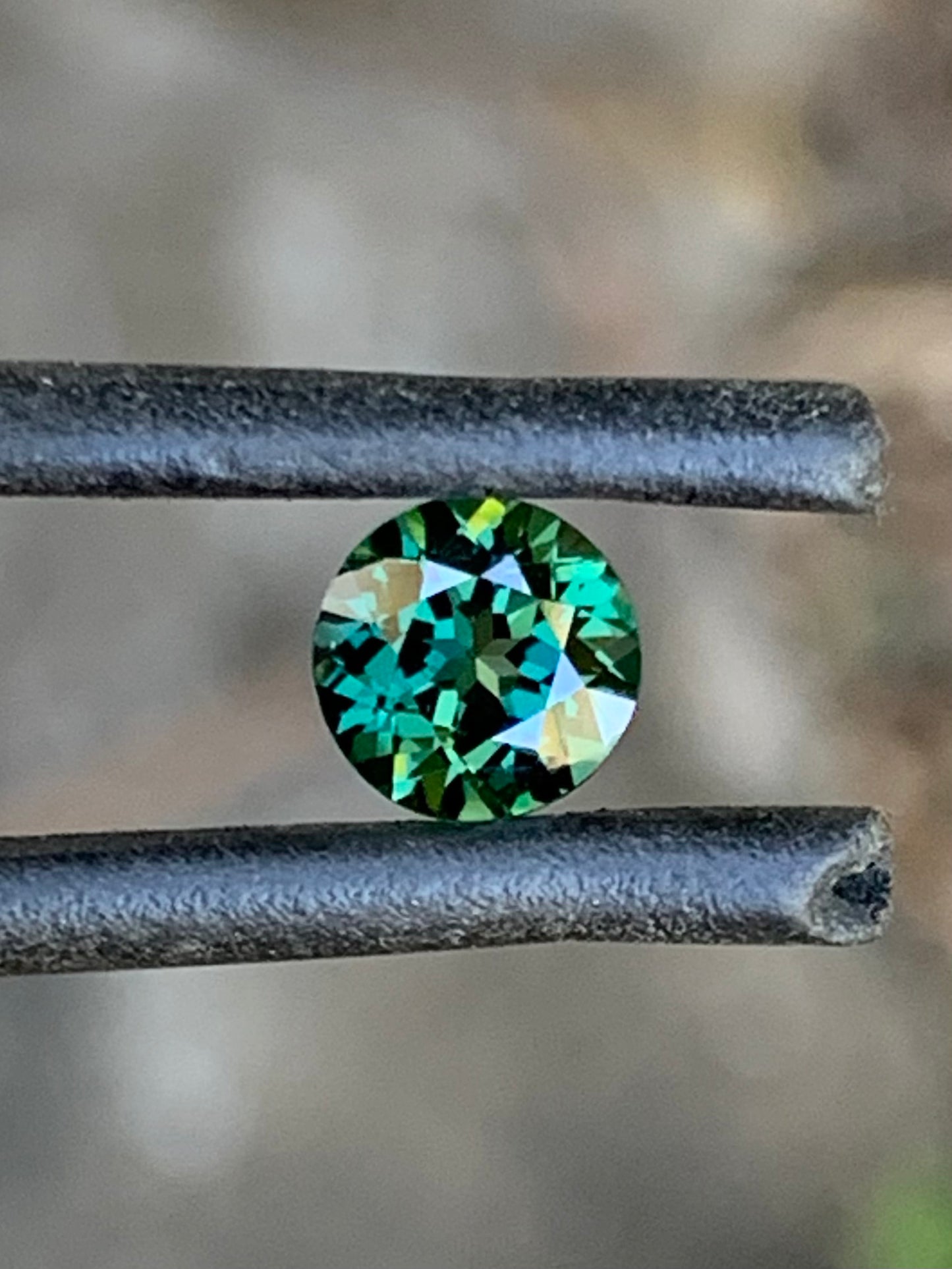 Natural Australian teal parti sapphire with vibrant face-up colour