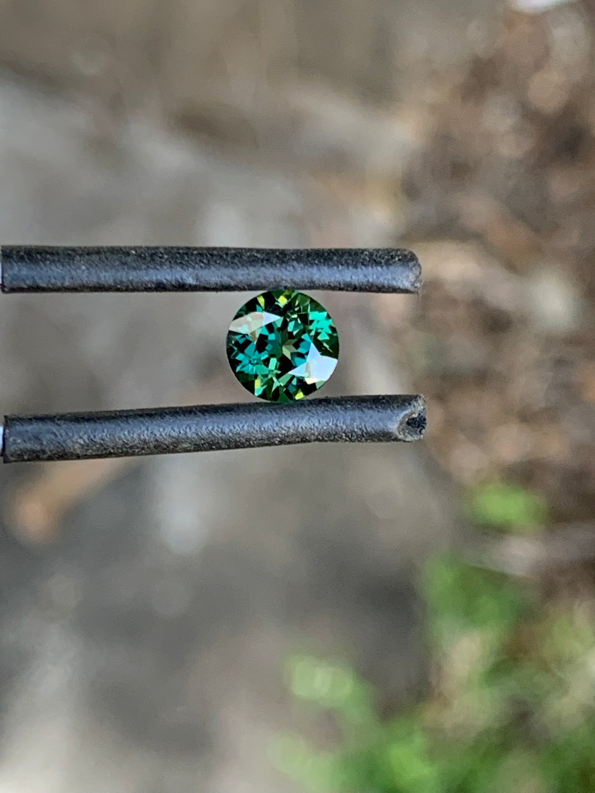 Round teal parti sapphire sourced from the Central Queensland Gemfields