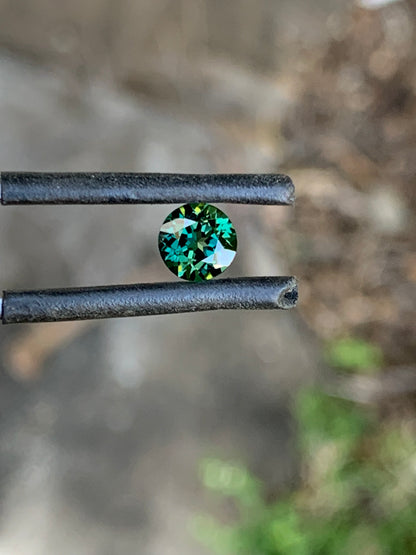 Round teal parti sapphire sourced from the Central Queensland Gemfields