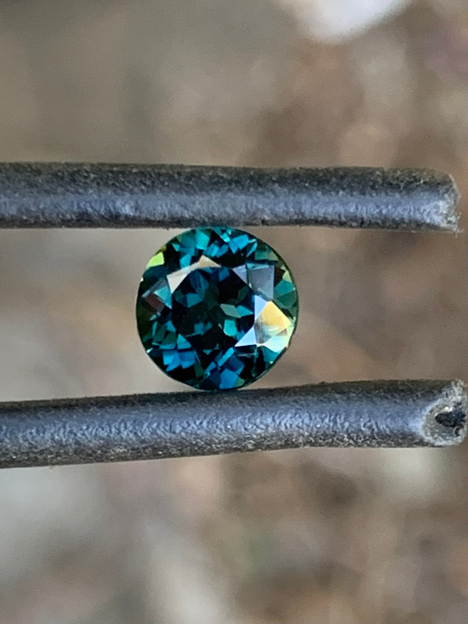Close-up of a 1.22ct teal blue Australian sapphire