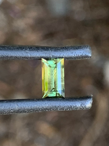 Close-up of a 0.87ct green baguette cut sapphire from Australia