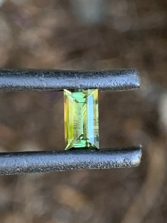 Close-up of a 0.87ct green baguette cut sapphire from Australia