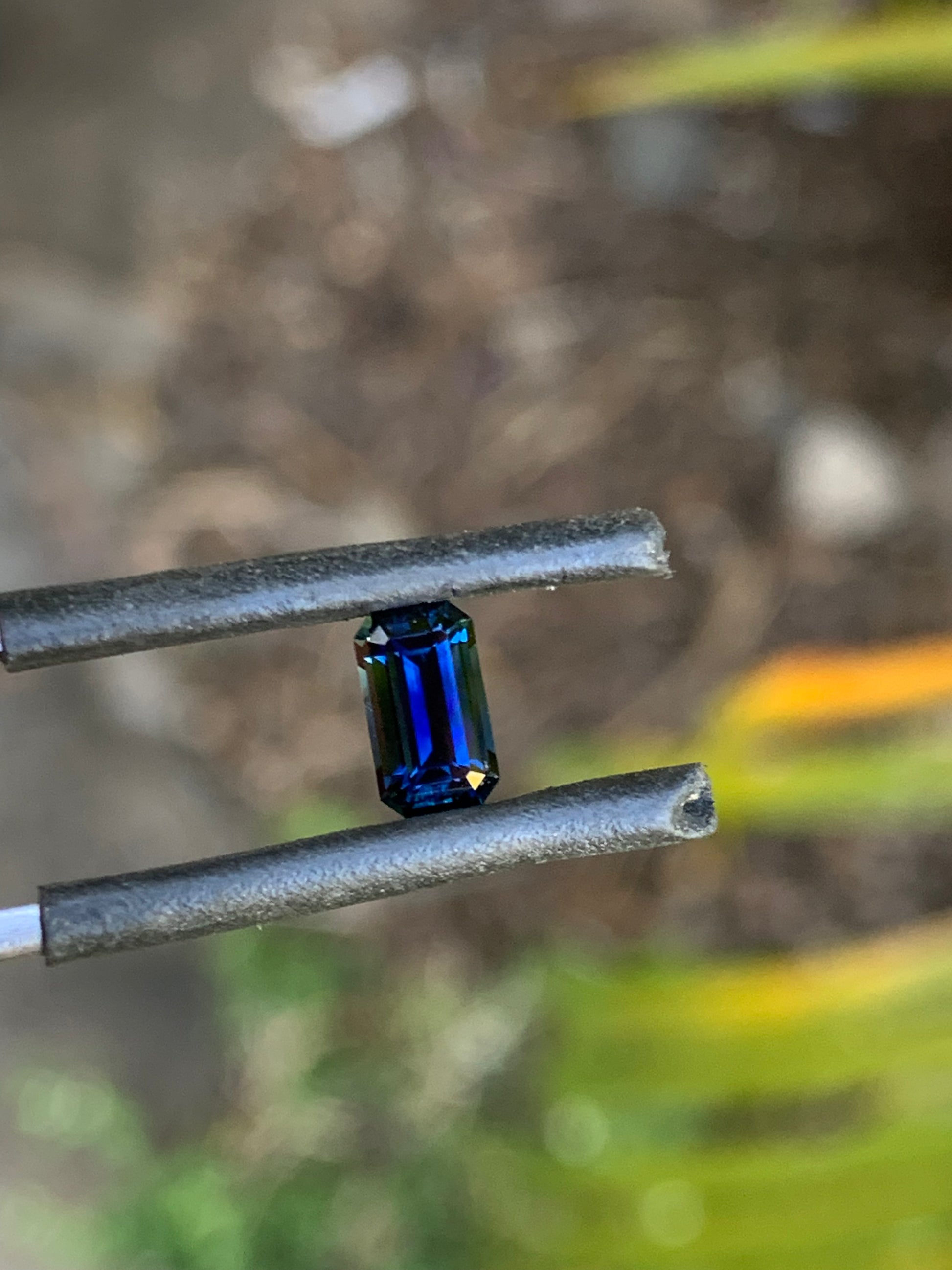 Natural blue sapphire with refined emerald cut facets