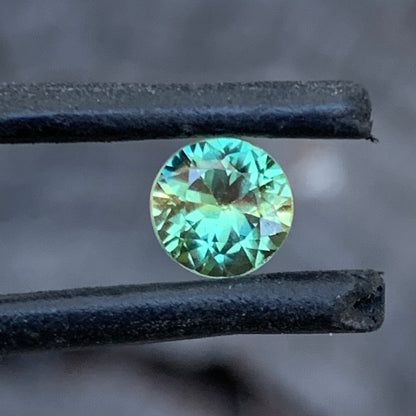 0.93ct yellow green wattle parti Australian sapphire, round cut, unheated