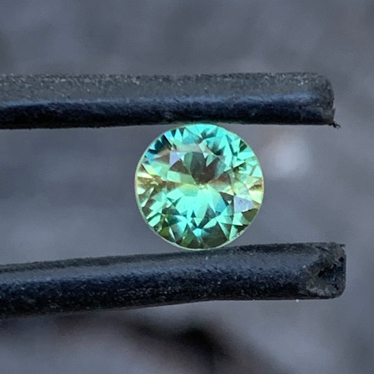 0.93ct yellow green wattle parti Australian sapphire, round cut, unheated