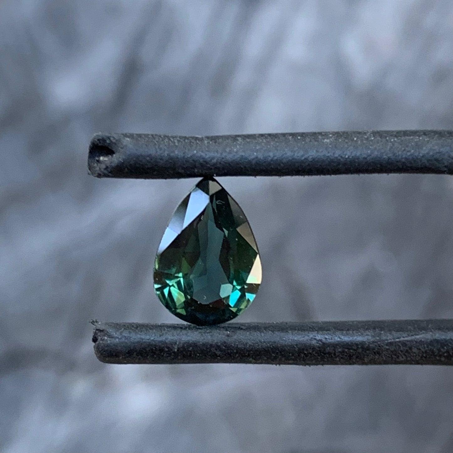 Pear shaped Australian sapphire showing rich deep teal colour