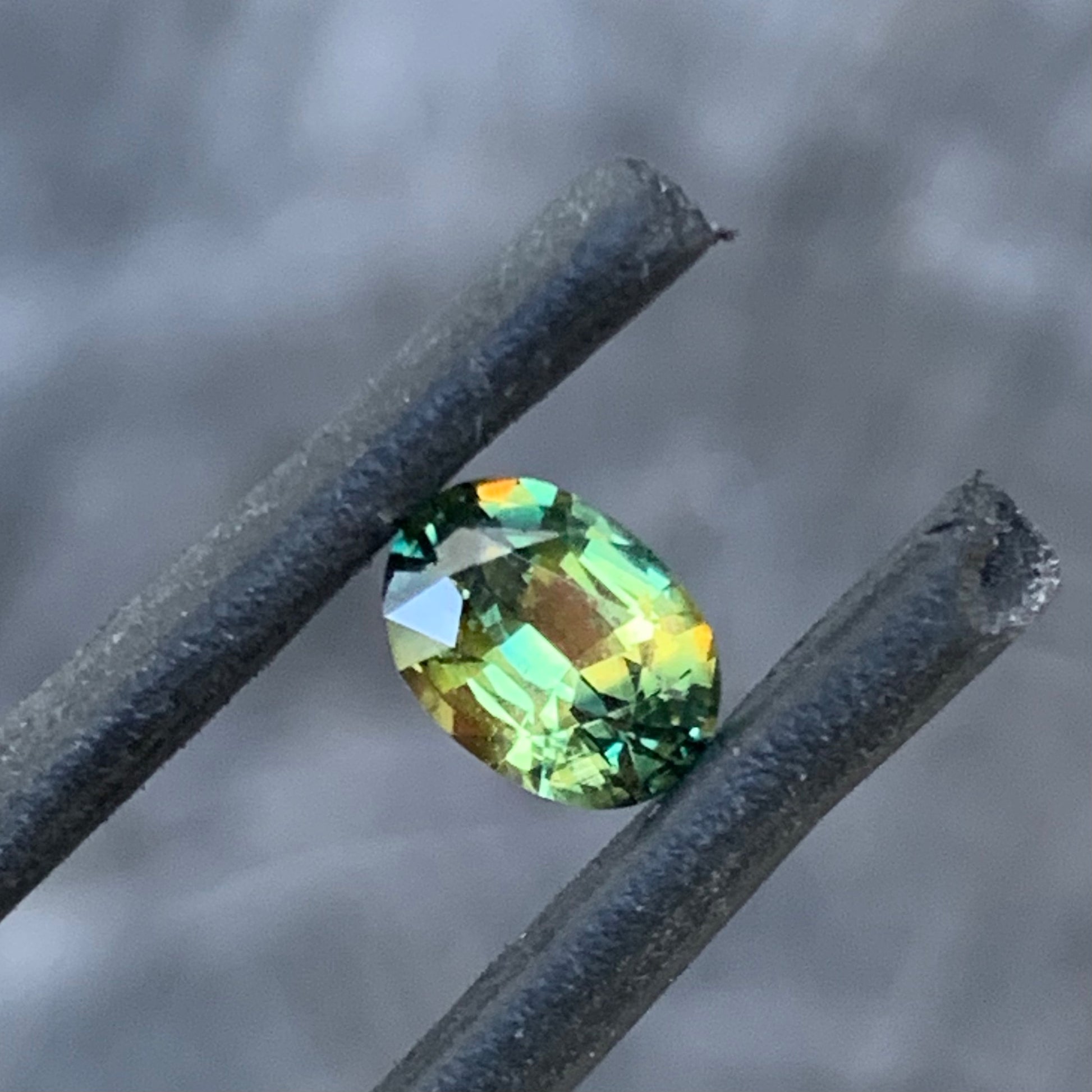 0.73ct yellow green parti Australian sapphire, oval cut