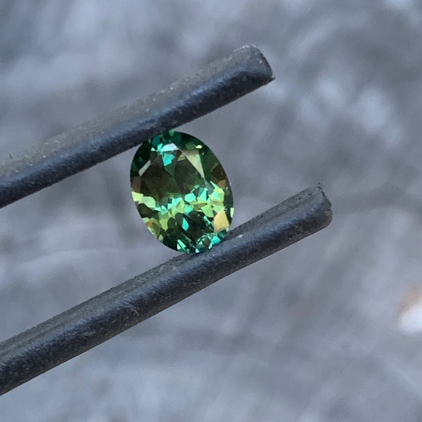 Bright green oval Australian sapphire from the Central Queensland Gemfields