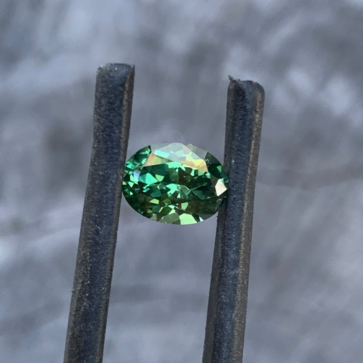 Oval cut green sapphire with a fresh and lively appearance