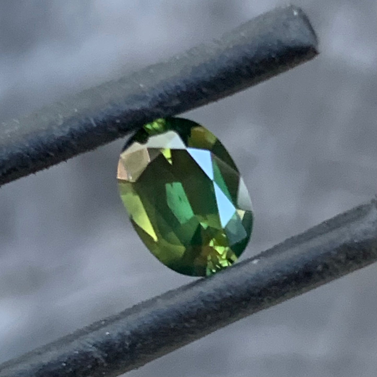 Chartreuse green Australian sapphire with bright colour and refined oval shape