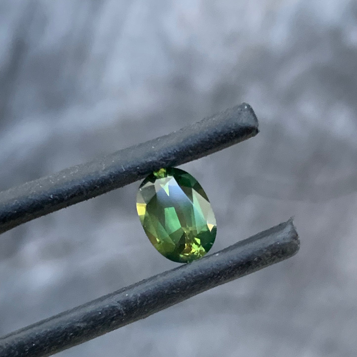 Bright chartreuse green oval sapphire from the Central Queensland Gemfields