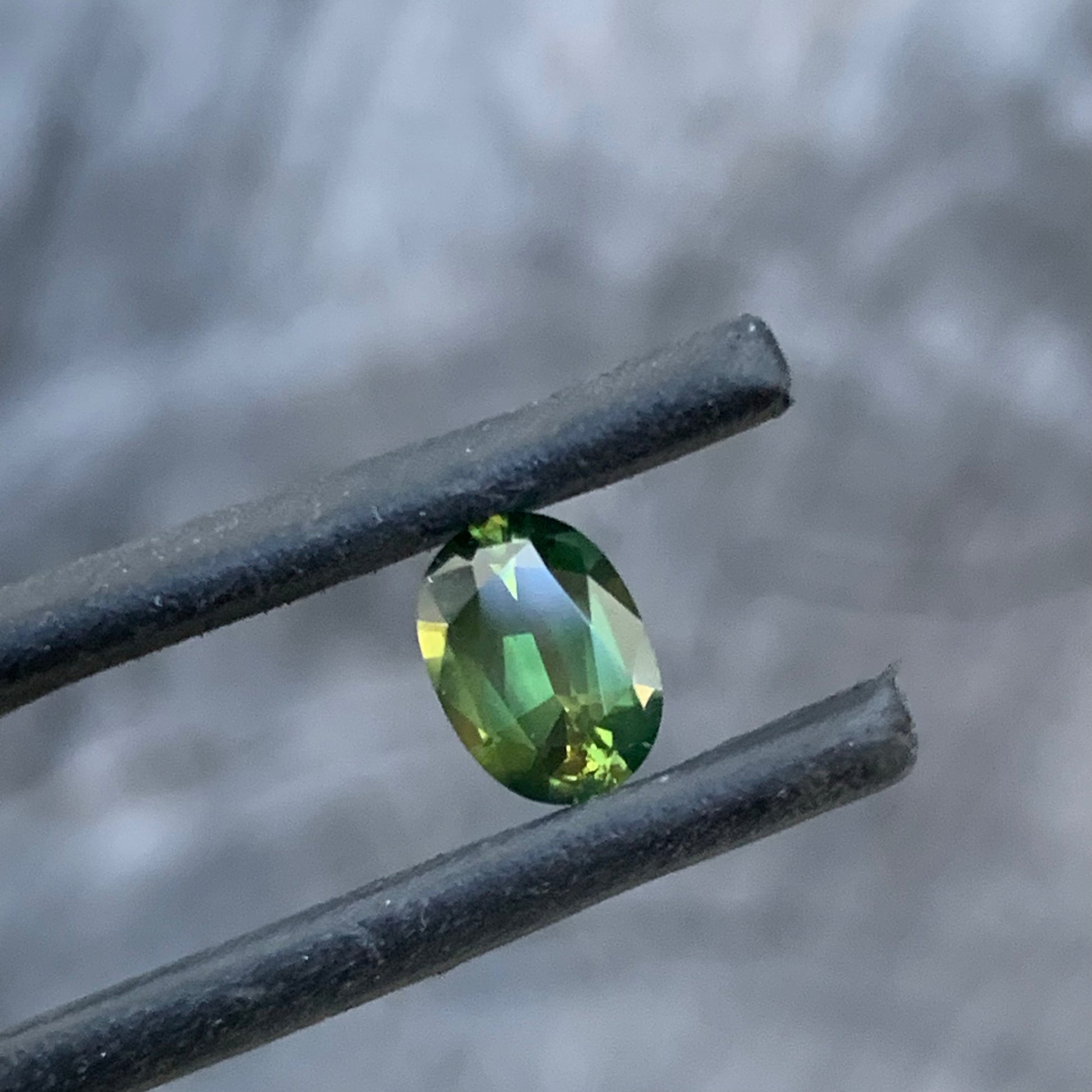 Bright chartreuse green oval sapphire from the Central Queensland Gemfields