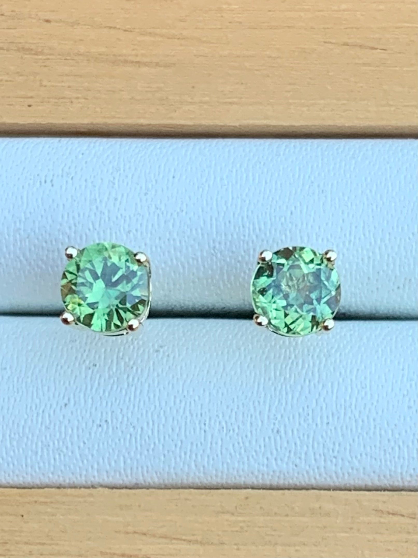 Close up of Green Australian Sapphire Stud Earrings