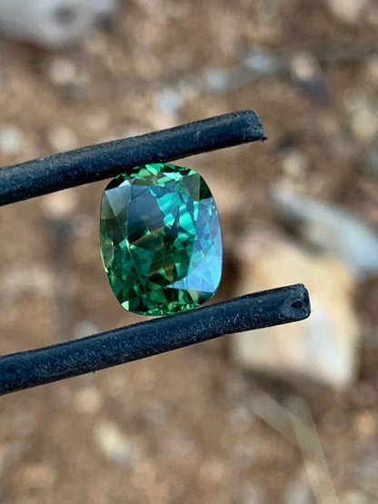 5.02ct cushion cut Australian parti sapphire with bright green and yellow tones