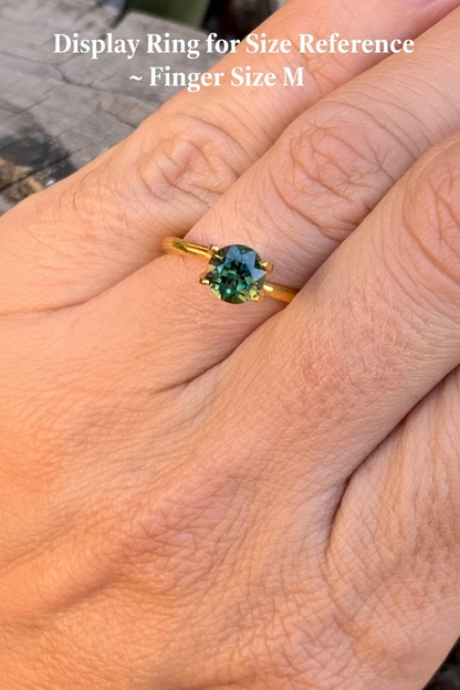 Green and yellow parti sapphire on hand for size reference
