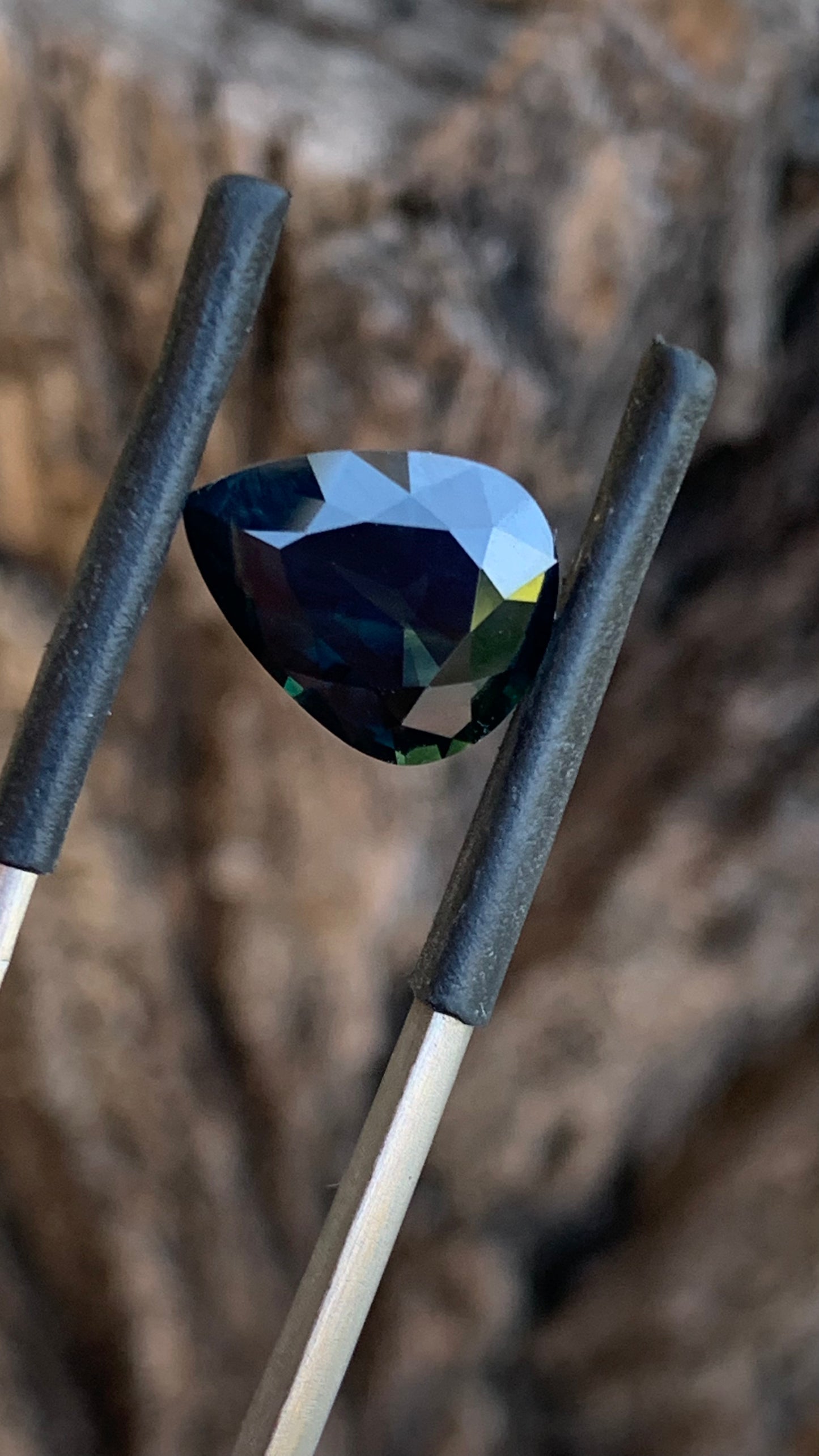 Large pear shaped Australian sapphire with moody blue and yellow parti colour