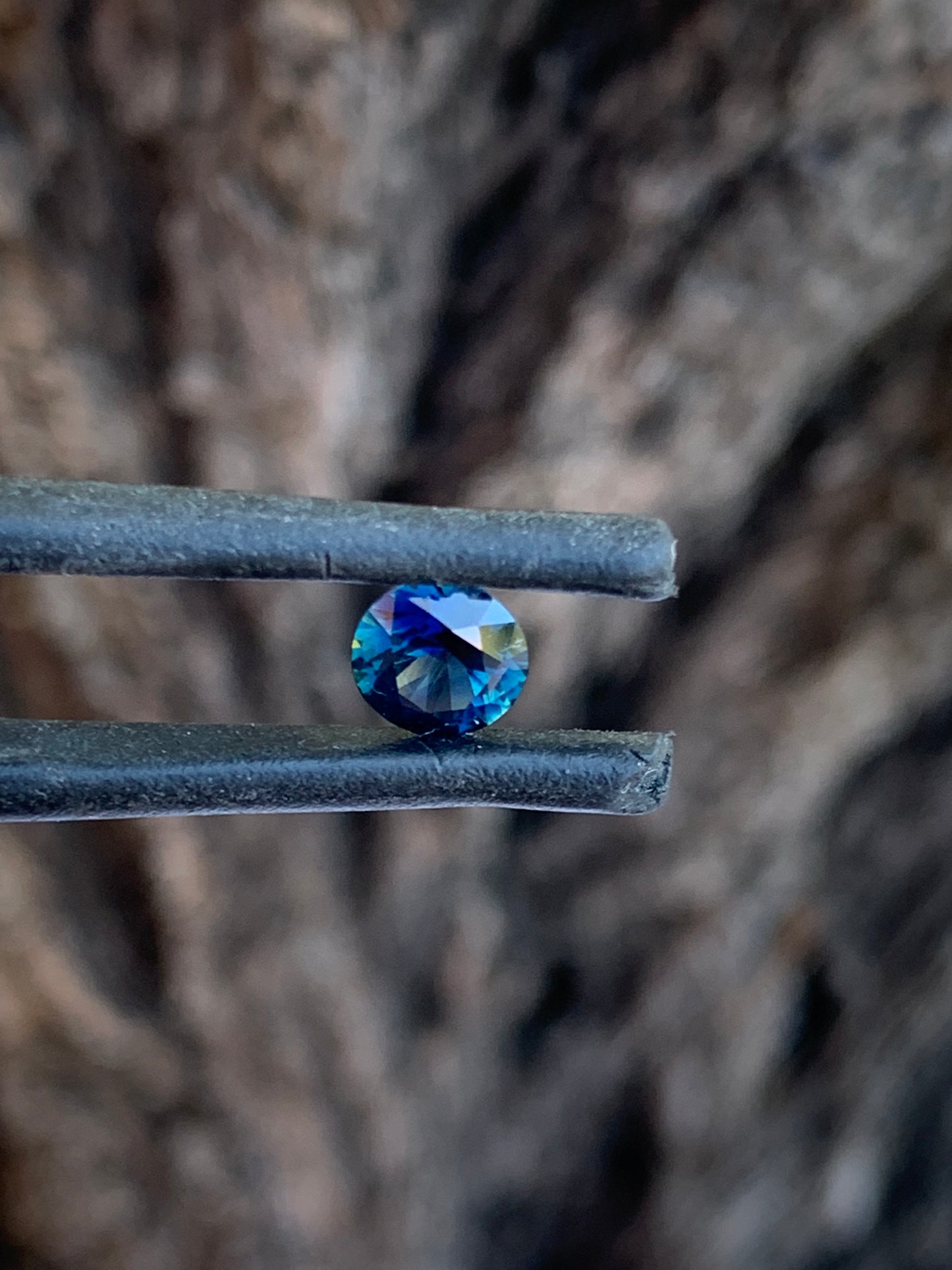 Natural round Australian sapphire with intense blue colour and small yellow parti zone