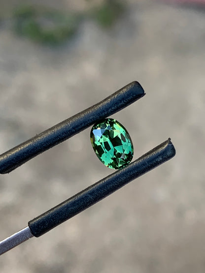 Natural green Australian sapphire with vivid lively colour and oval cut