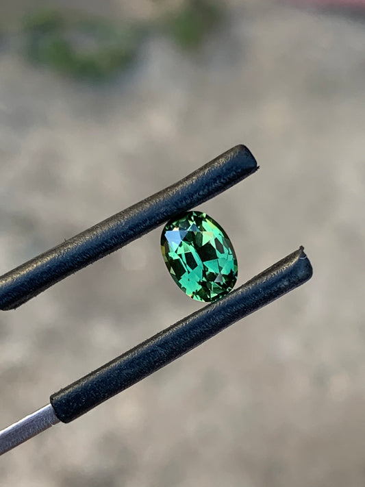 Natural green Australian sapphire with vivid lively colour and oval cut