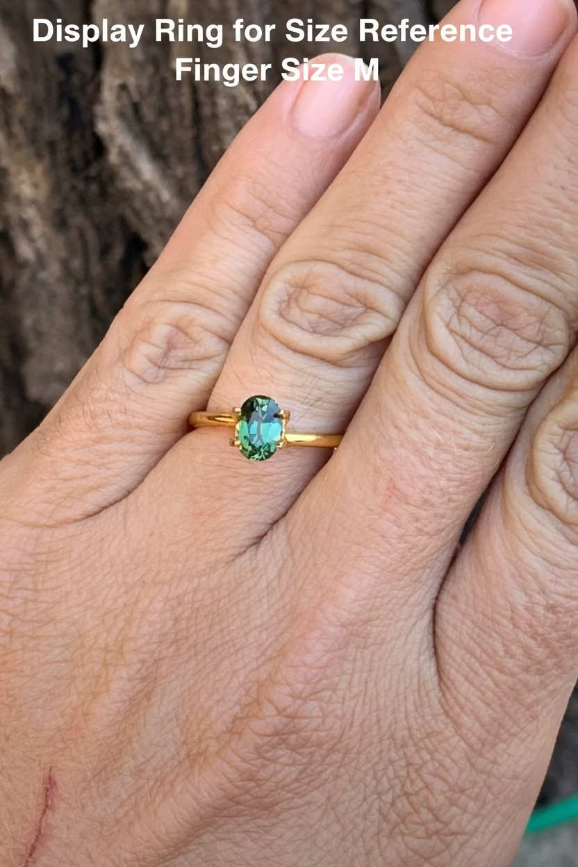 1.12ct Green Australian sapphire on a hand for size reference